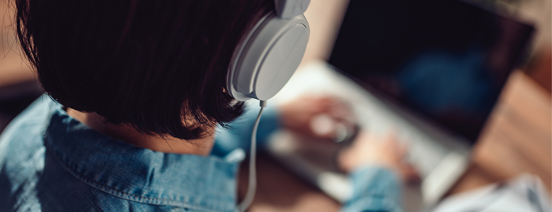 Employee working while wearing headphones